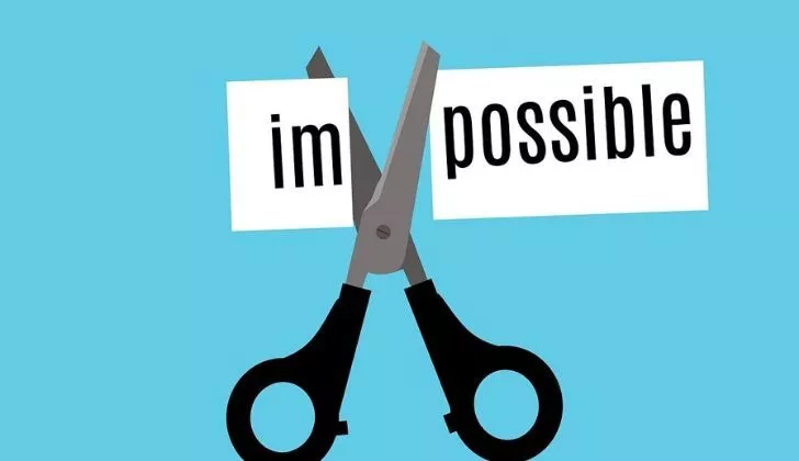 The word impossible split into 'im' and 'possible' with scissors