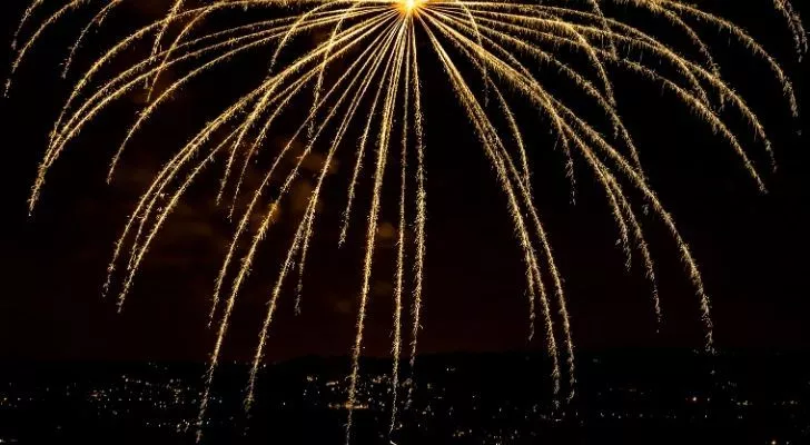 A golden firework showering the night sky