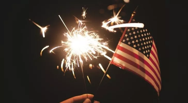 a sparkler and a USA flag