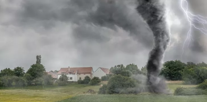 A tornado close to a country house