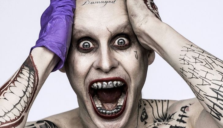 Joker from Suicide Squad with lots of teeth tattoos