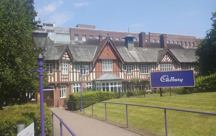 Cadbury World from the front with the factory behind it.