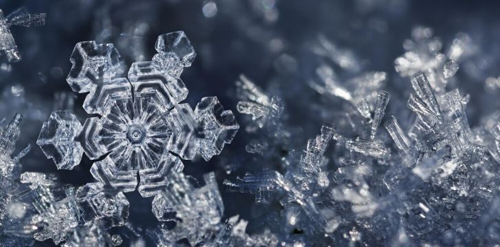 A closeup of snowflakes showing depth and detail.