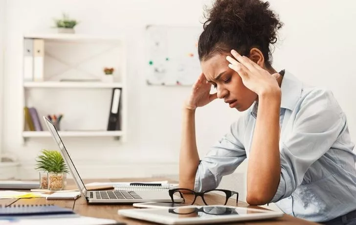 A woman looking stressed and weak