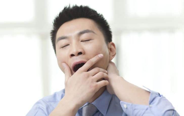 A man yawning
