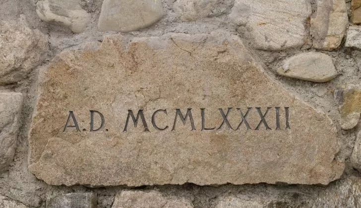 A stone plaque with Roman numerals