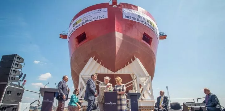 David Attenborough standing infant of the ship he was named after
