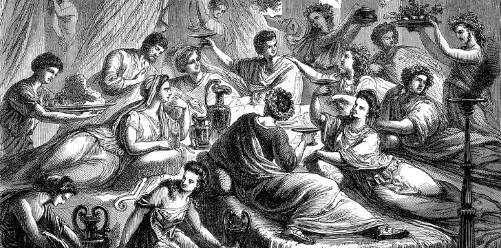 A group of Ancient Romans laying down at a banquet.