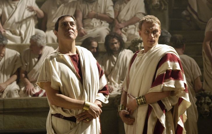Two men wearing classic Roman Tongas.