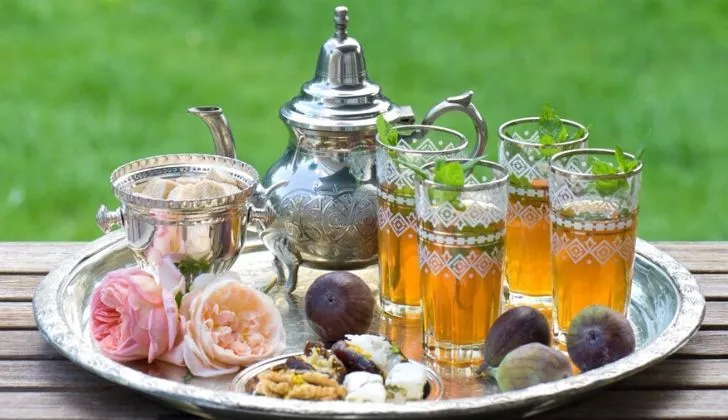 Tray with tea and fruit.