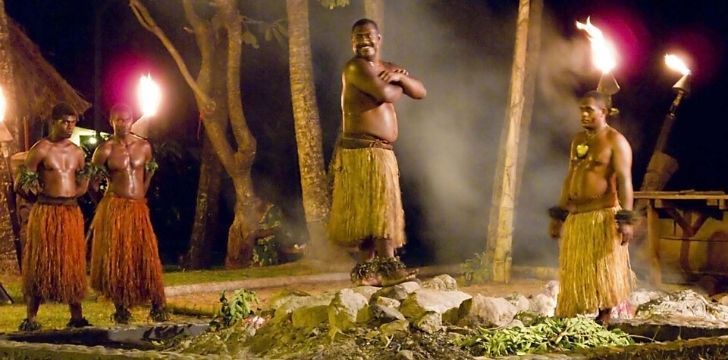 Fijian men fire walking