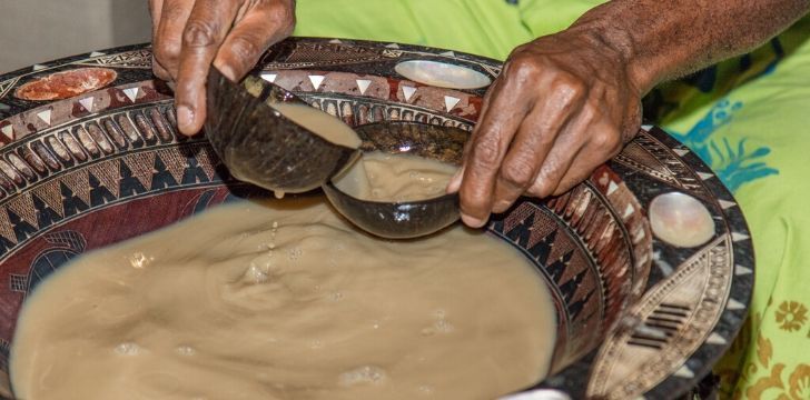 A woman serving kava
