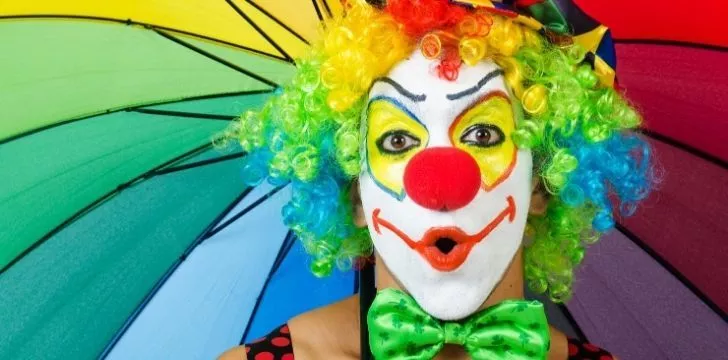 A clown with exaggerated makeup