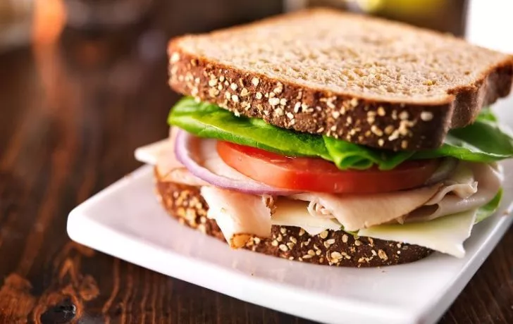 Delicious ham sandwich with lettuce and tomato