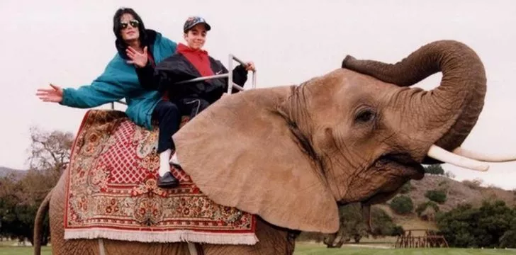 Michael Jackson riding an elephant