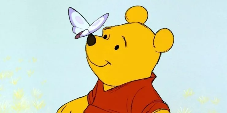 Winnie the Pooh with a butterfly on his nose