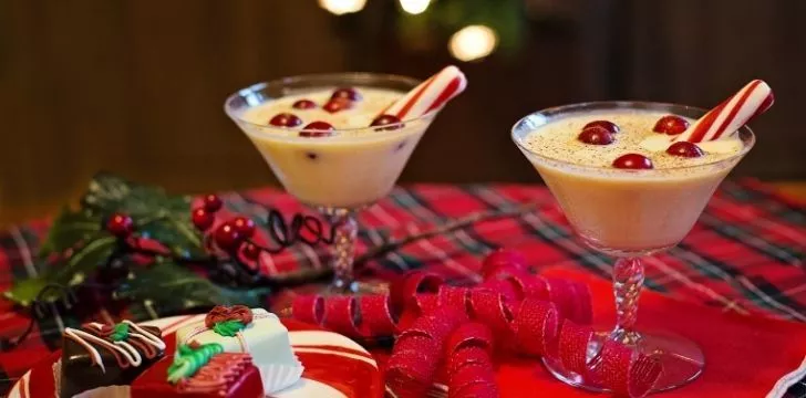 Two cocktail glasses of eggnog