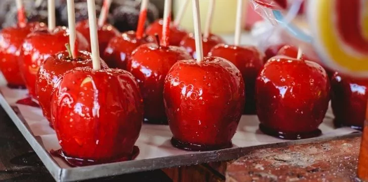 Rows of red candy apples