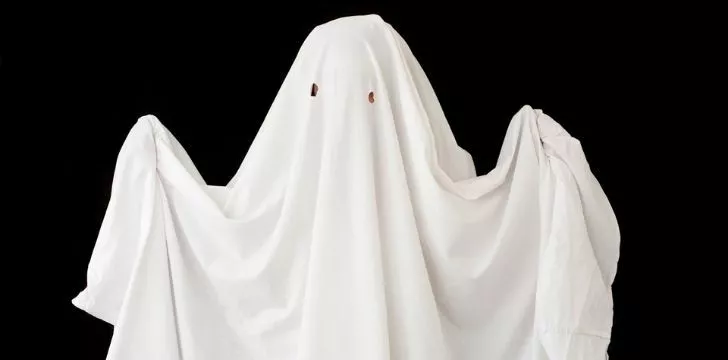 A ghost made of a white bed sheet