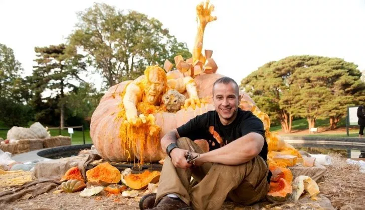 Ray Villafane with his apocalypse carved pumpkin behind him