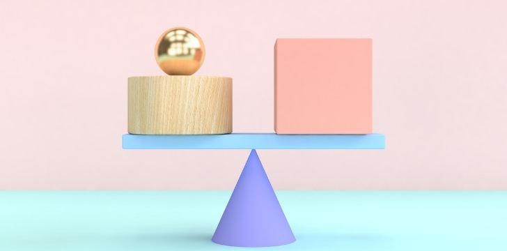 Blocks being balances on a scale