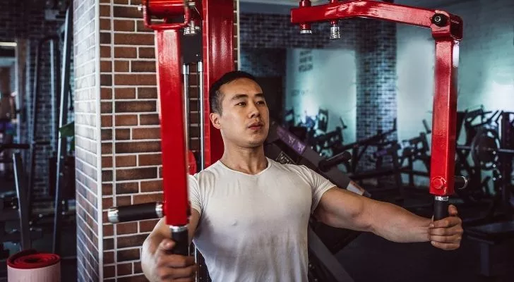 A man using a weight training machine