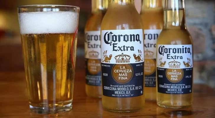 Corona beer bottles and a glass