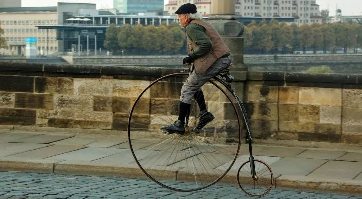 The penny farthing bicycle with a large front wheel and small back wheel