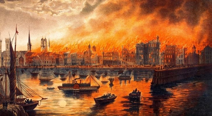 La impresión de un artista del Gran Incendio de Chicago con muchos edificios en llamas