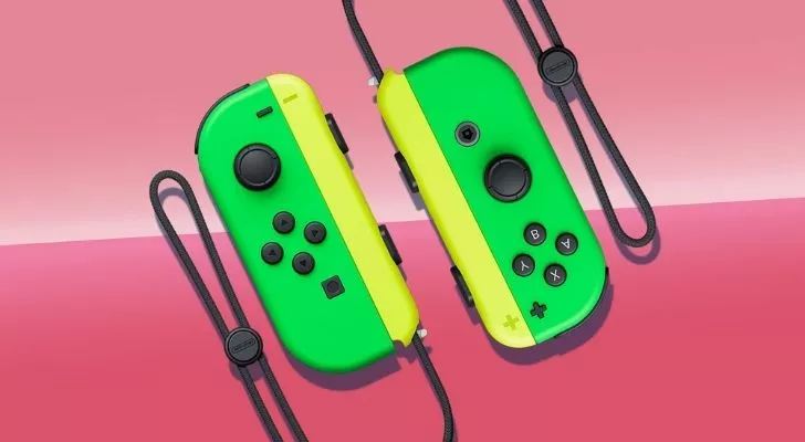 Two green and yellow Switch controllers