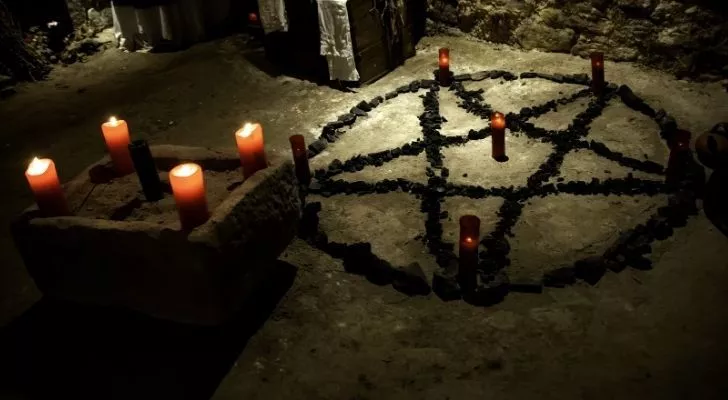 The satanic symbol and candles