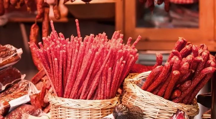 Thin sausage sticks in baskets