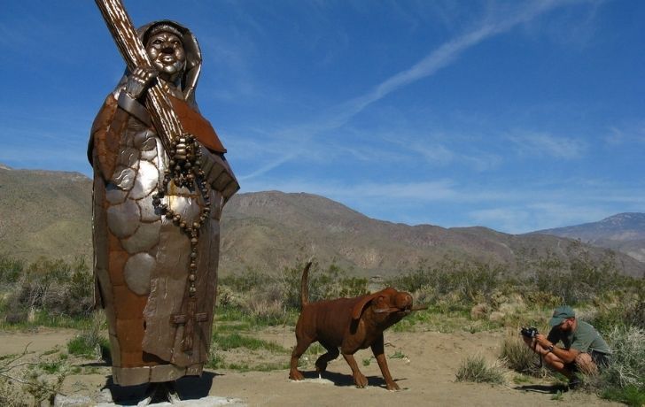 A sculpture of Francisco Garces and his dog