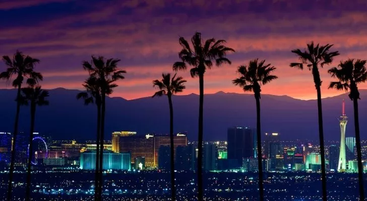 Vegas at night with mountains in the distance