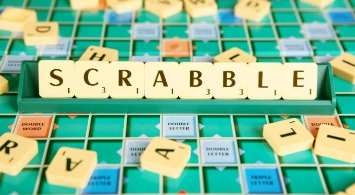 A Scrabble board and tiles spelling out "SCRABBLE"