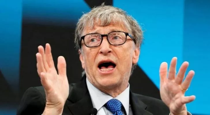 Bill Gates with his hands up