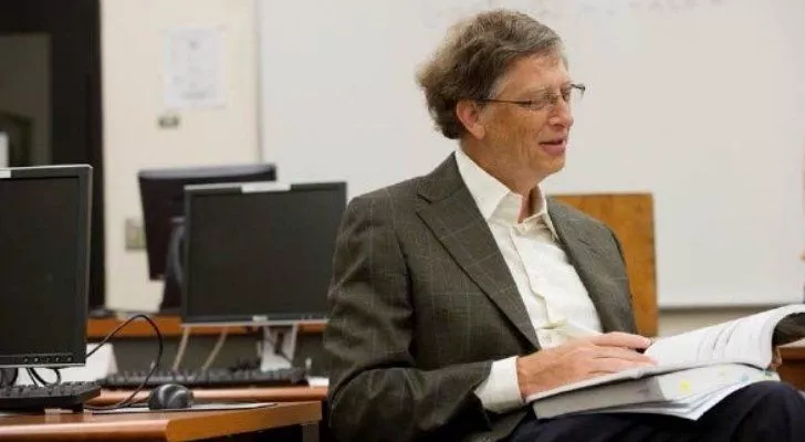 Bill Gates reading a book