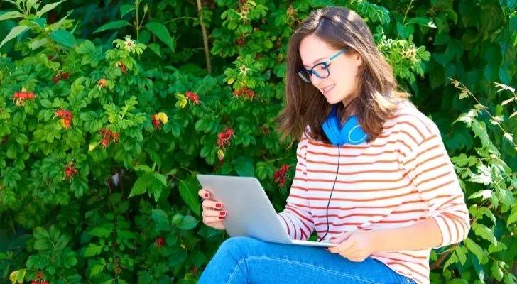 A gullible woman reading an email from Prince Charming of Nigeria