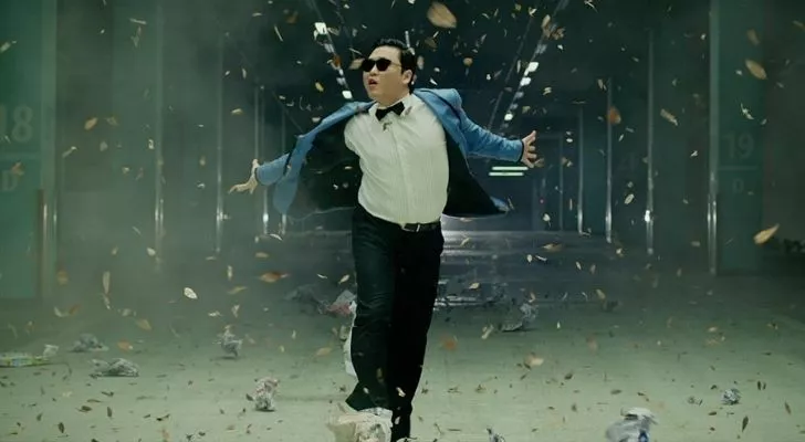 Pay dancing in a suit wearing sunglasses