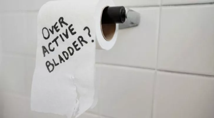 Toilet paper with "over active bladder?" written on it