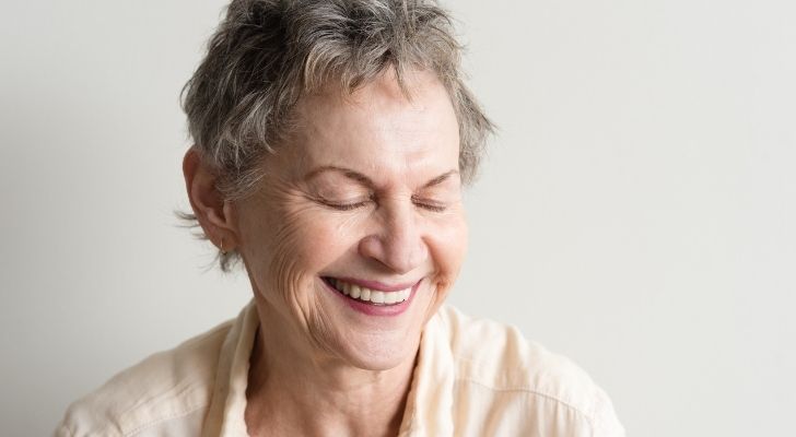 An older woman laughing