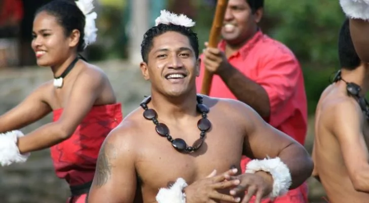 Happy Hawaiian people dancing