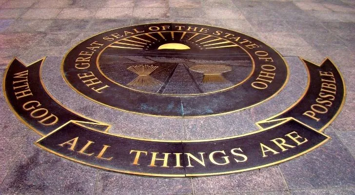 A Ohio motto plaque on marble flooring