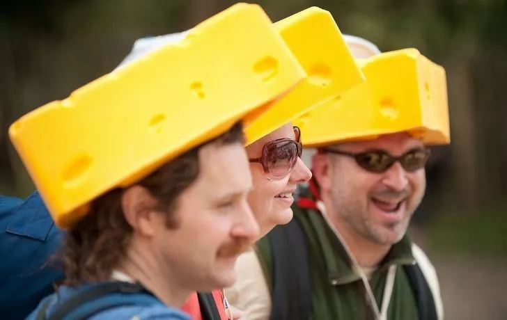 Men with blocks of cheese on their heads