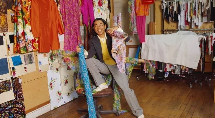 Kenzo Takada in a studio full of fabrics