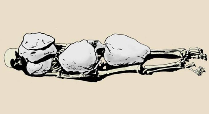 An Ancient Greek skeleton weighed down by heavy rocks