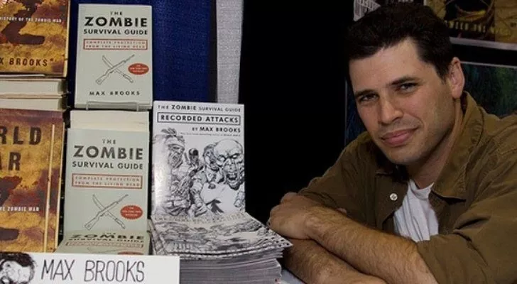 Max Brooks with his books