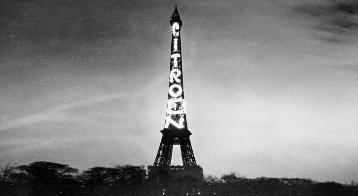 An old photo of the Eiffel Tower with CitroÃ«n being advertised on it
