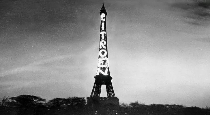 An old photo of the Eiffel Tower with Citroen being advertised on it