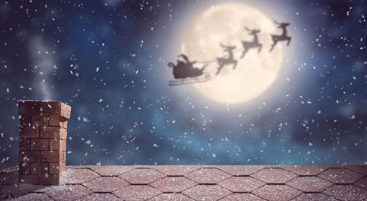 Santa on his sleigh in the sky on Christmas Eve